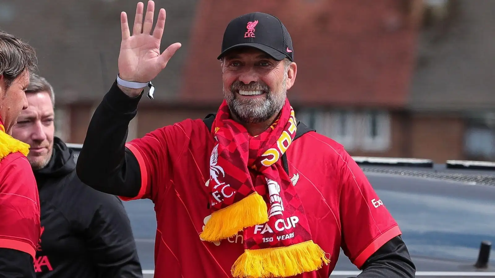 Jurgen Klopp waves throughout Liverpool's ceremony in 2022.