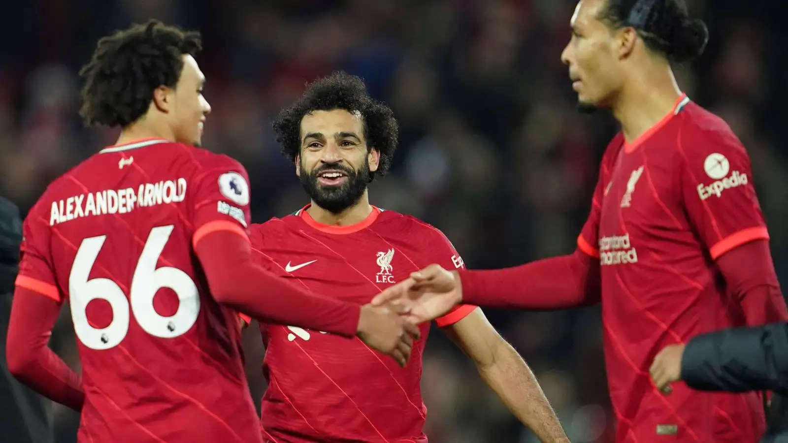 Liverpool players Mohamed Salah, Trent Alexander-Arnold and Virgil van Dijk be satisfied a impartial.