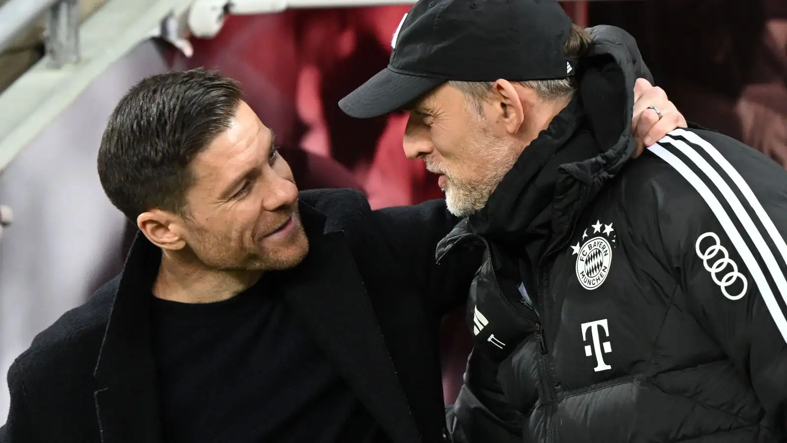 Reported Liverpool target Xabi Alonso greets Thomas Tuchel before a suit.