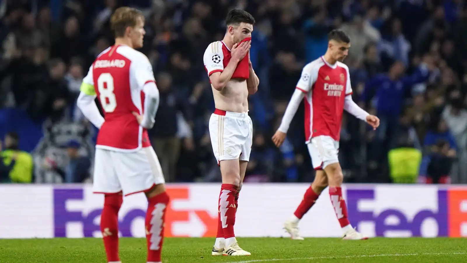 Arsenal players look dejected after conceding a goal.