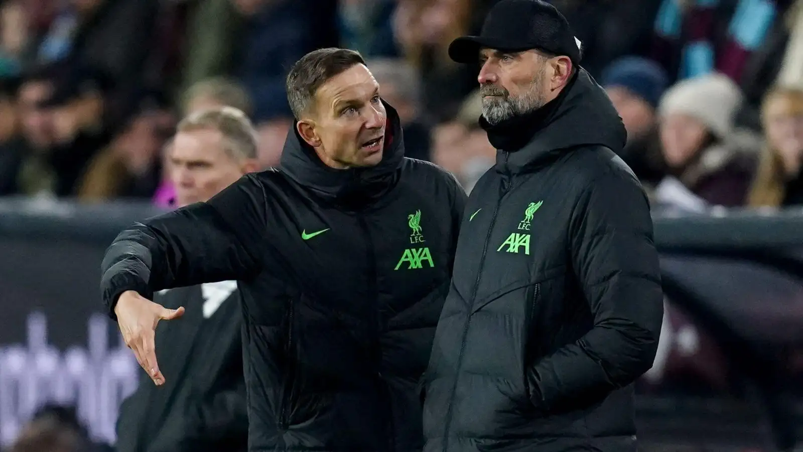 Liverpool assistant Pep Lijnders explains tactics with Jurgen Klopp.