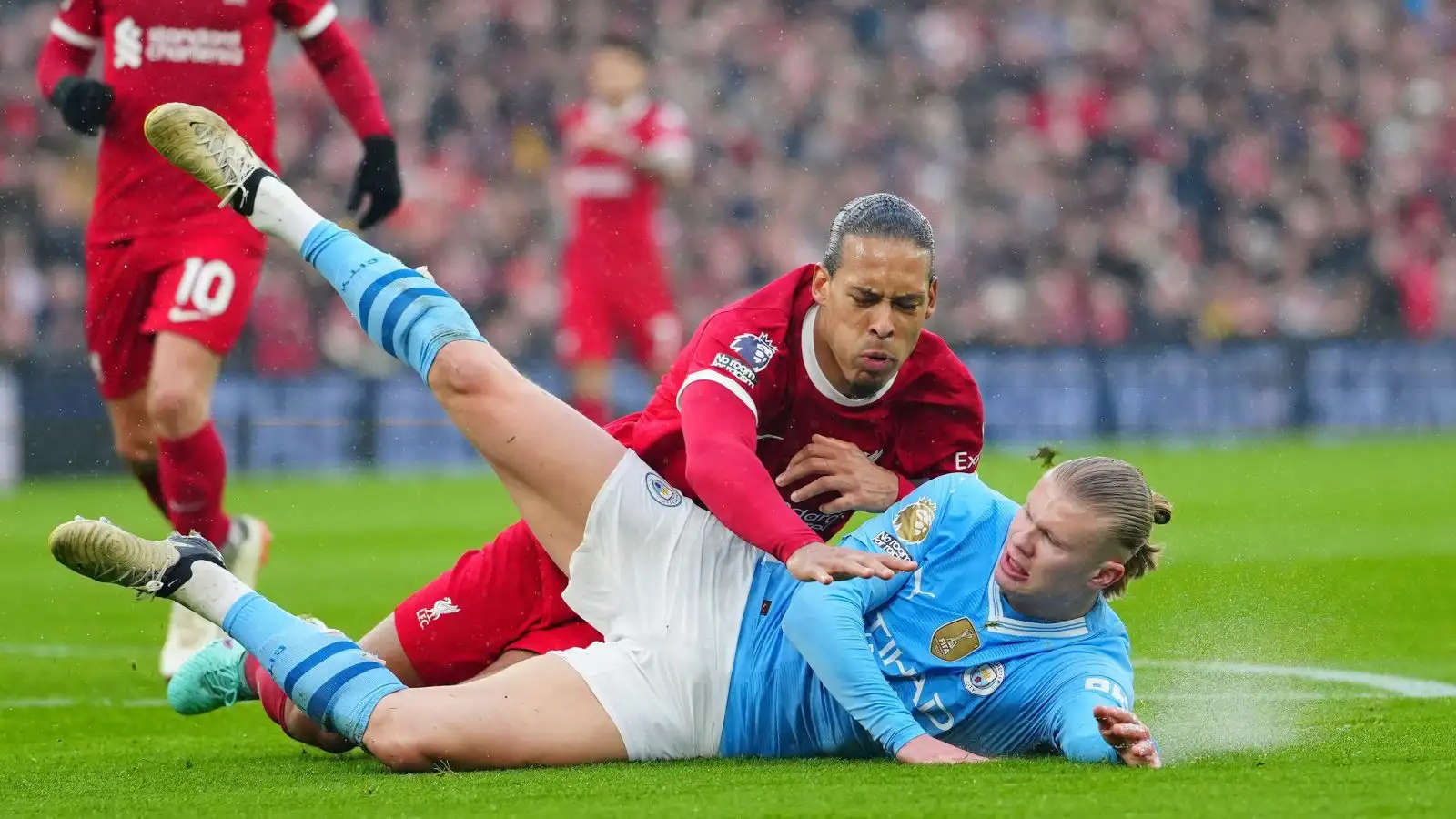 Liverpool protector Virgil van Dijk as well as Male City forward Erling Haaland tumble to the progression throughout a testing-dealt with match at Anfield