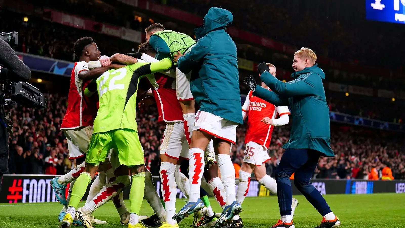 Tool kit players mob David Raya after his penalty shootout heroics.