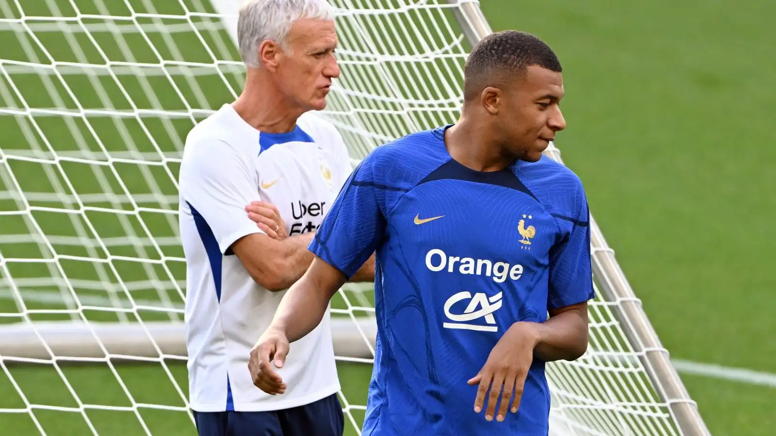 Kylian Mbappe and also Didier Deschamps during a France training session.