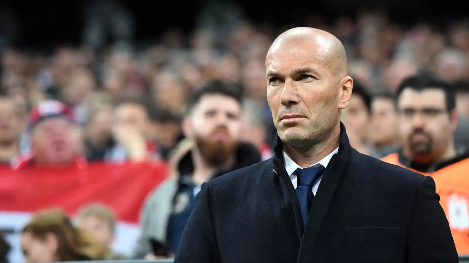 Zinedine Zidane ganders on during a suit.