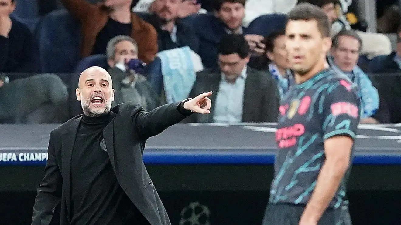 Manchester Metropolis manager Pep Guardiola as well as midfielder Rodri