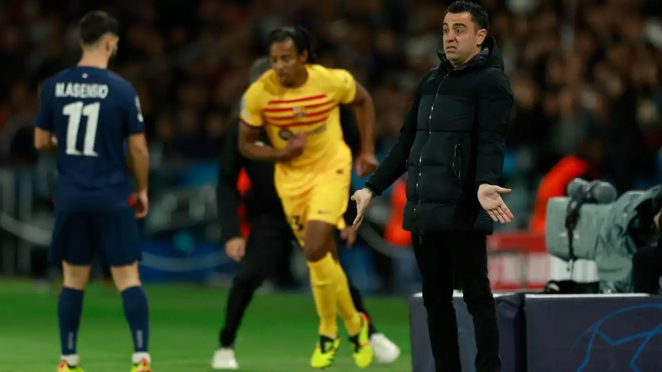 Xavi motions during PSG v Barcelona