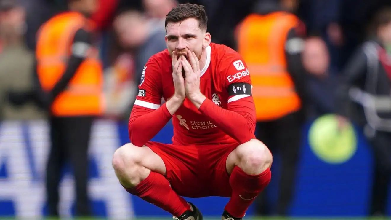 Liverpool left-back Andy Robertson looks dejected after a defeat