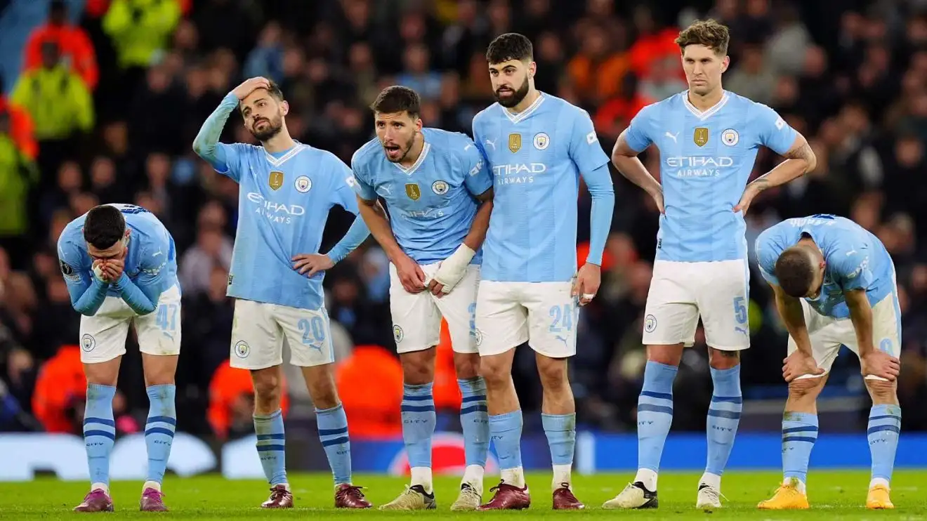 Manchester City players reacting to a penalty miss