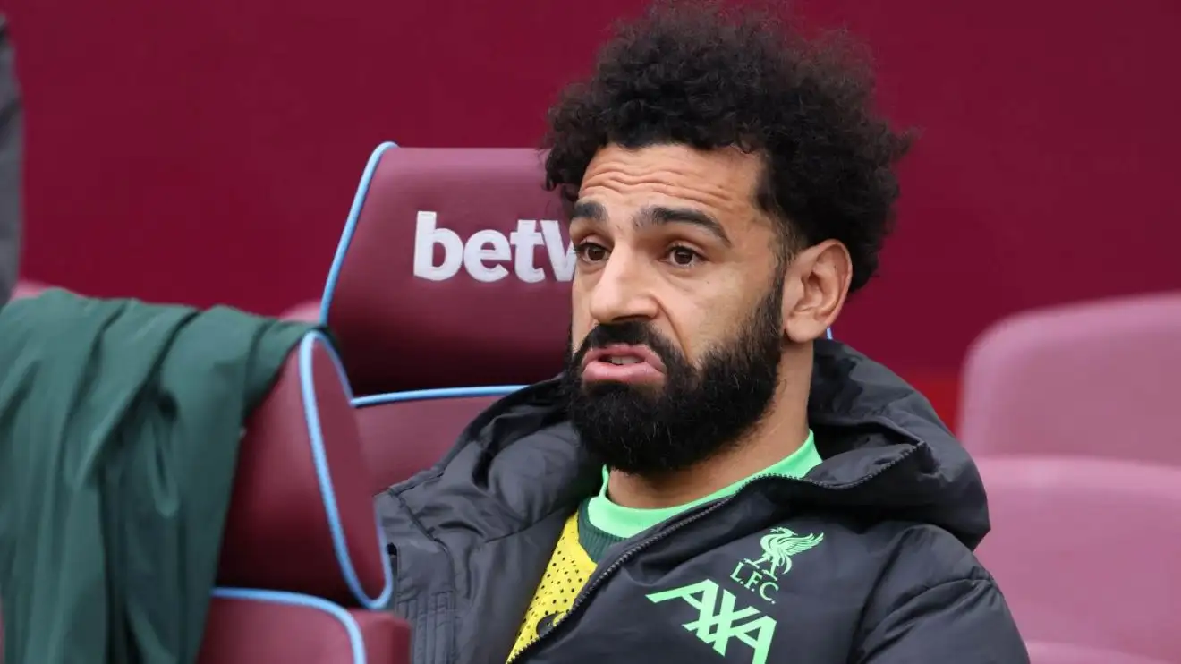 Mohamed Salah makes a humorous confront while sat on the bench