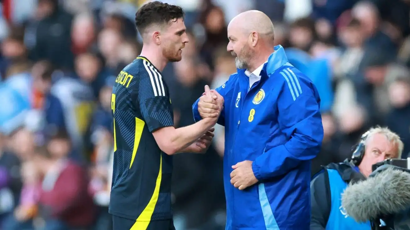 Scotland captain Andy Robertson and also Steve Clarke throughout a match