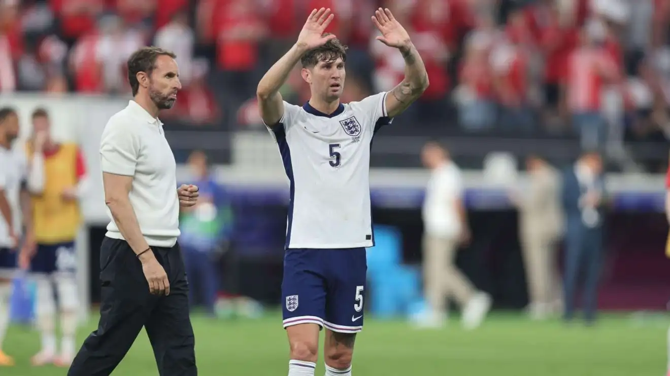 Stones calls for calm from England fans: 'This is tournament football and we are top of the group' 1 England gamer John Boulders and also employer Gareth Southgate after a suit