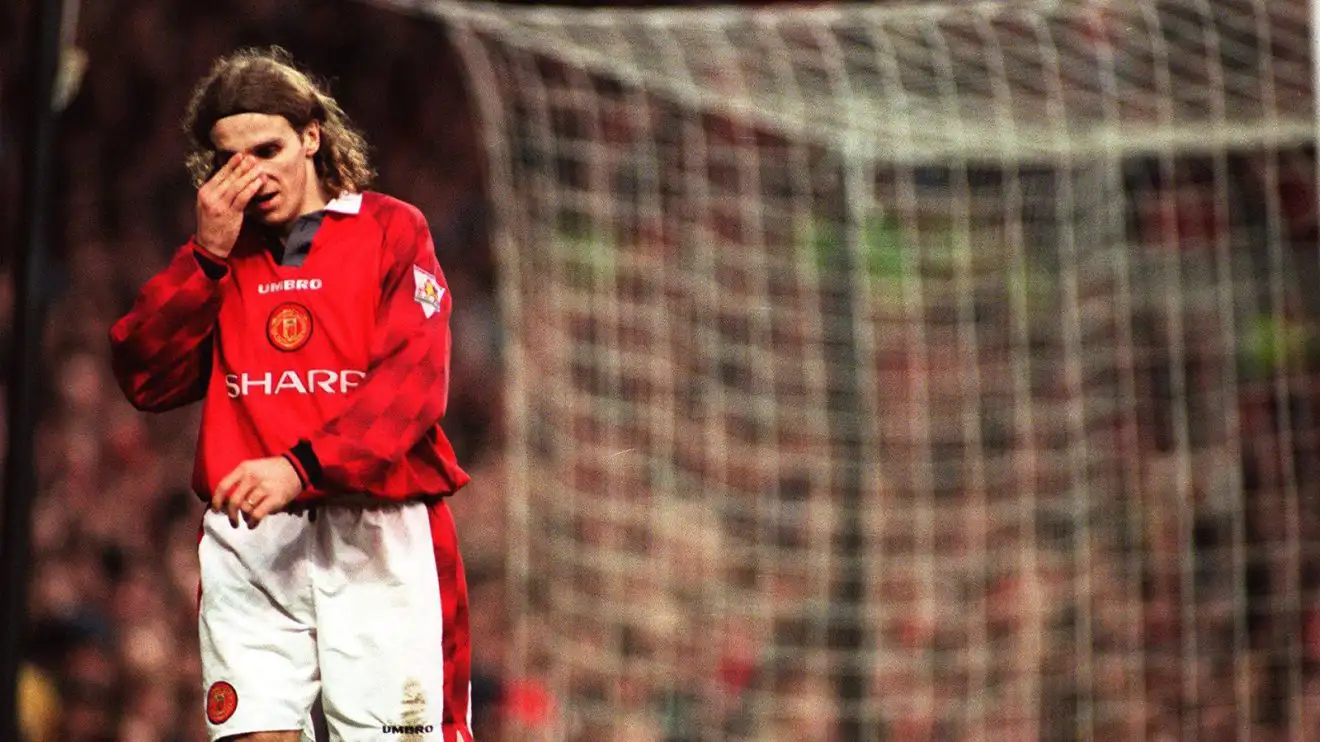 Karel Poborsky looking rueful while playing for Manchester United. His shirt looks dead baggy because it's the 90s