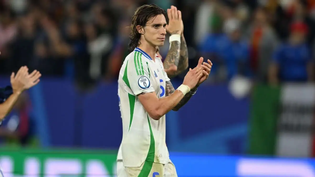 Arsenal target Riccardo Calafiori applauds the Italy followers after a match