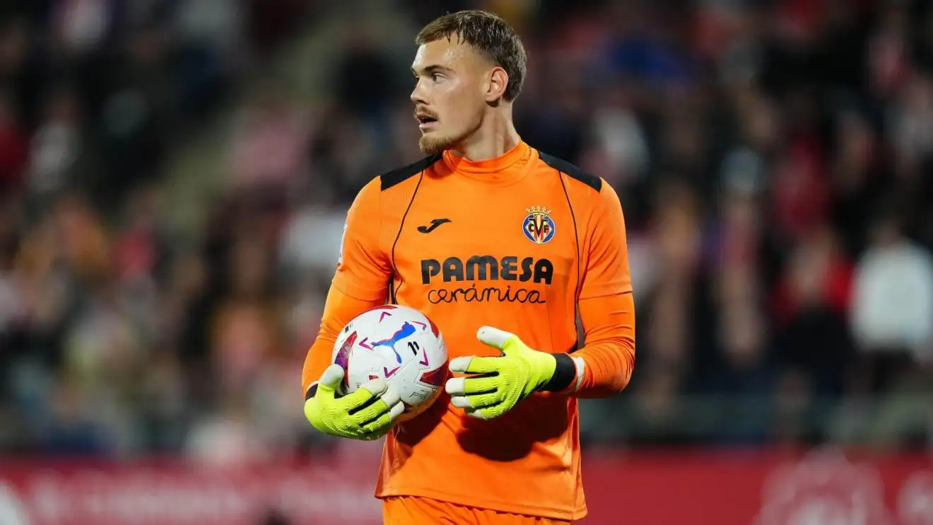 Chelsea 'deal done' for fourth goalkeeper signing in Boehly era - Fabrizio Romano 1 Chelsea target Filip Jorgensen grips onto the spheric during a match