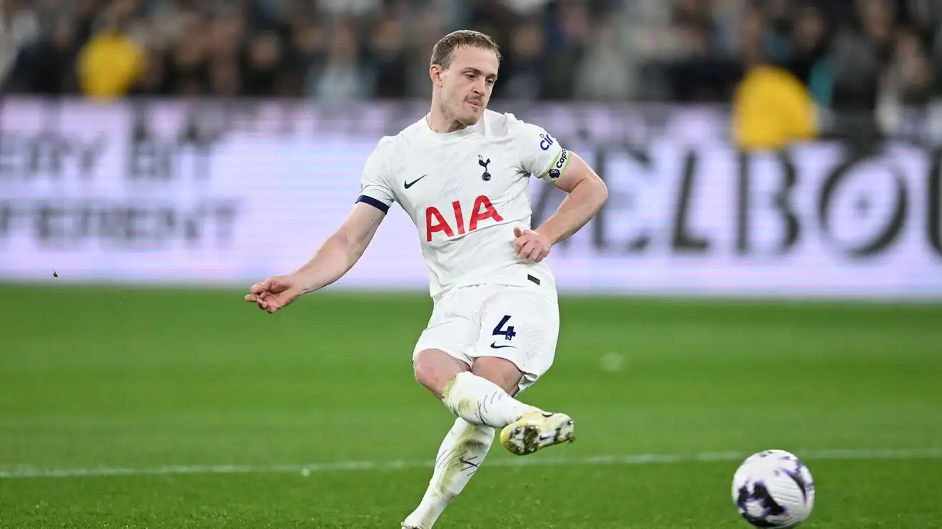 Oliver Skipp passes the ball while playing for Tottenham Hotspur