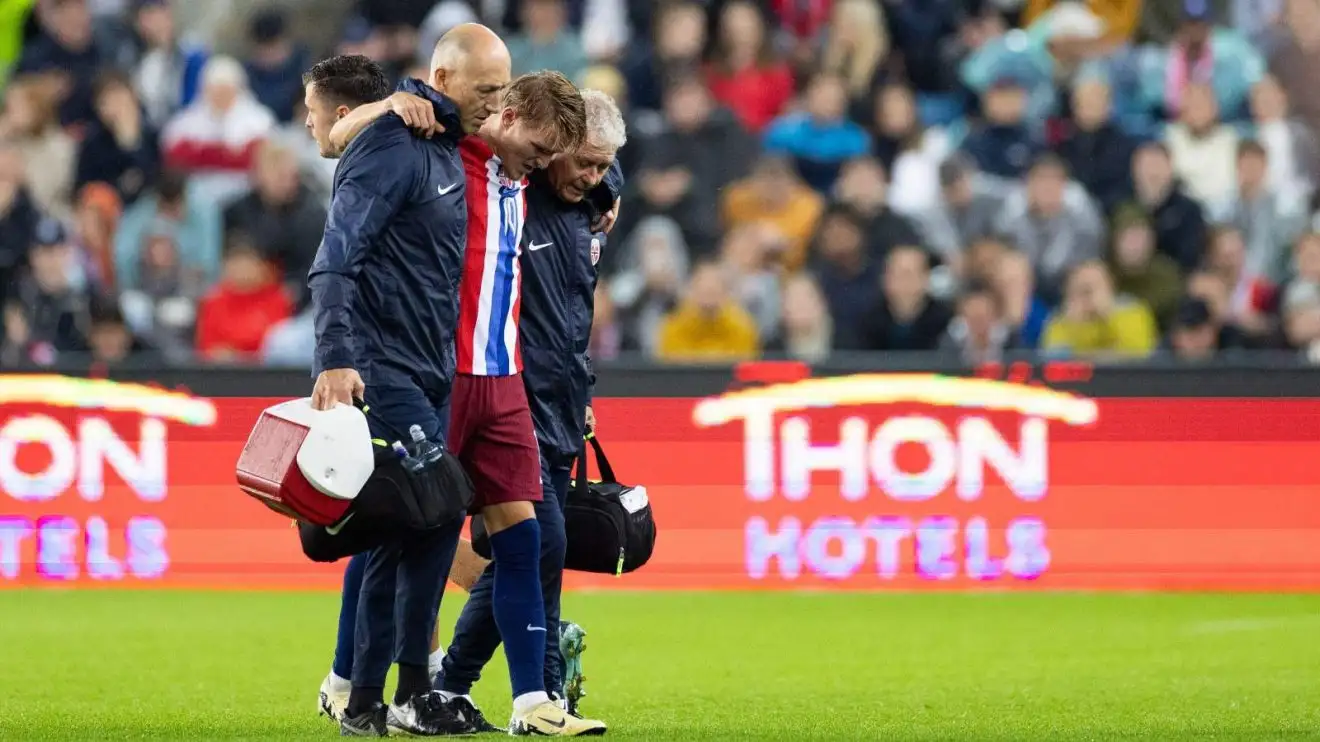 Norway captain Martin Odegaard is directed off with an ankle joint injury