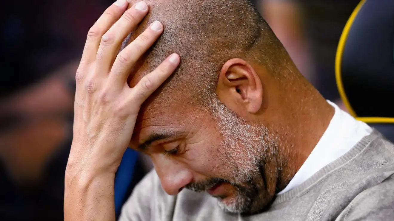 Guy Metropolis supervisor Pep Guardiola holds his head in dissatisfaction