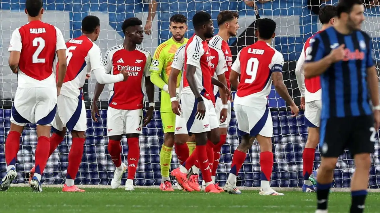 Atalanta 0-0 Arsenal: Heroic David Raya rescues Champions League draw for Gunners 1 David Raya is enclosed by his Arsenal group-playmates after maintaining a fine