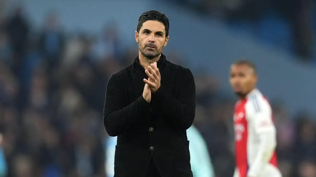 A disappointed-looking Mikel Arteta applauds at the Etihad Stadium