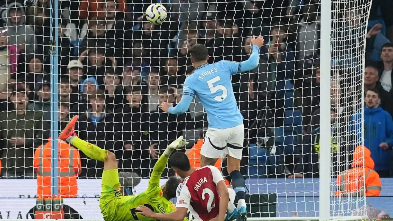 John Stones scores a 98th-minute equaliser for Manchester City against Arsenal