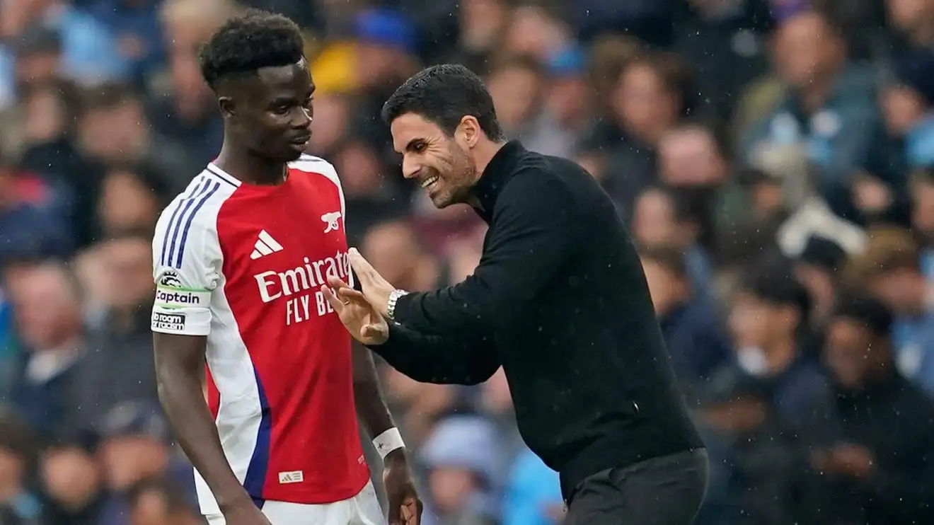 Hodgepodge player Bukayo Saka and also supervisor Mikel Arteta