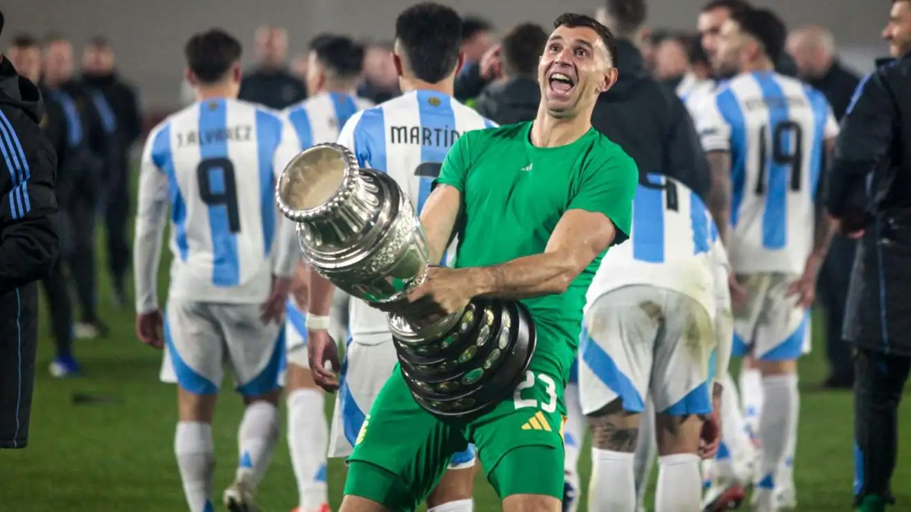 Emiliano Martinez celebrates wearing the Copa America prize