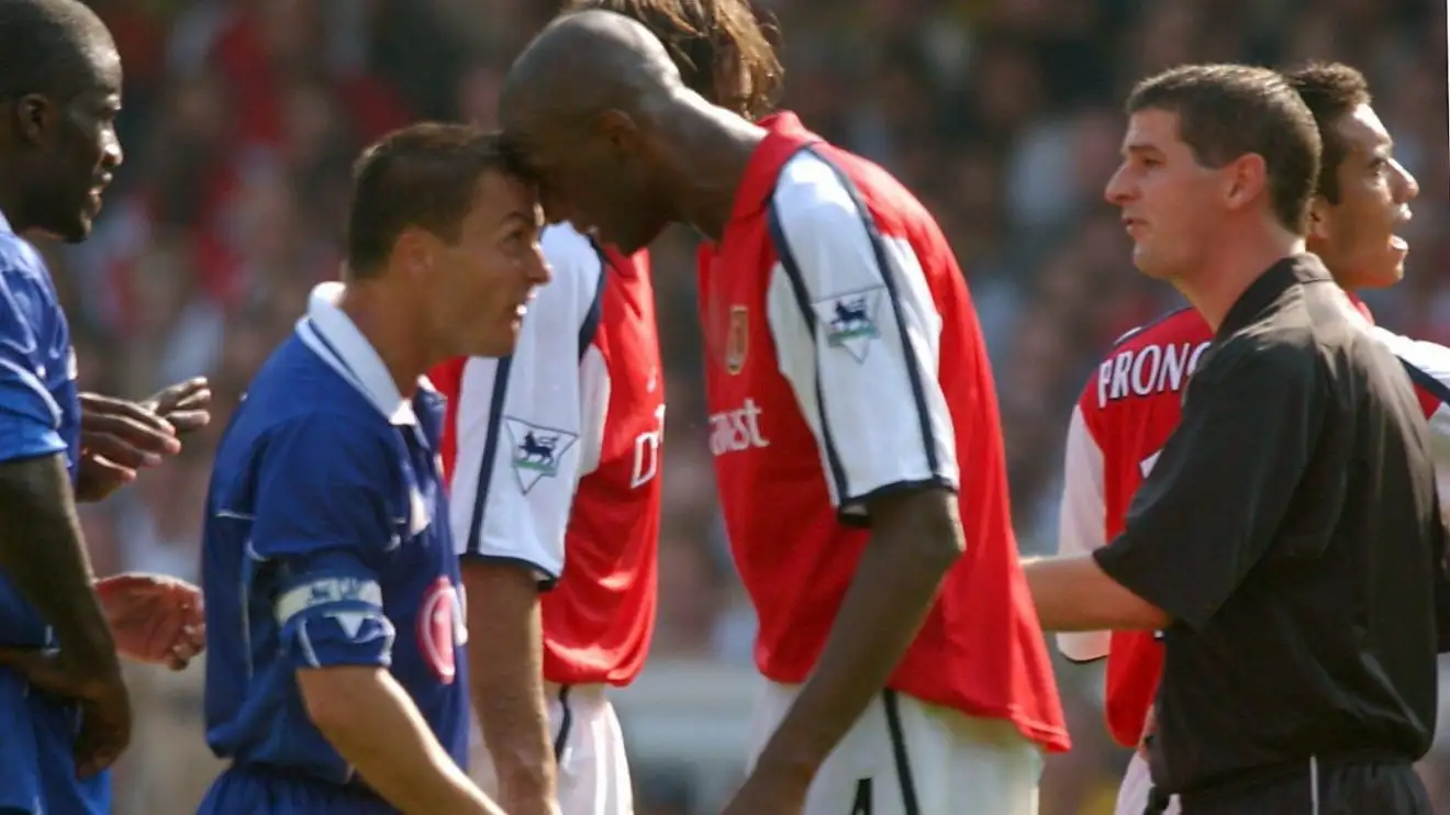 Patrick Vieira squares up to Dennis Wise.