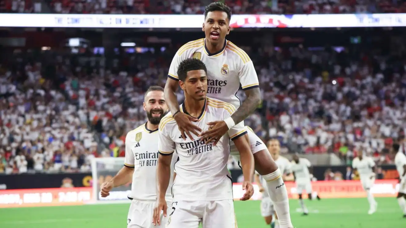 Liverpool-attached Real Madrid duo Rodrygo and Jude Bellingham celebrate a ambition