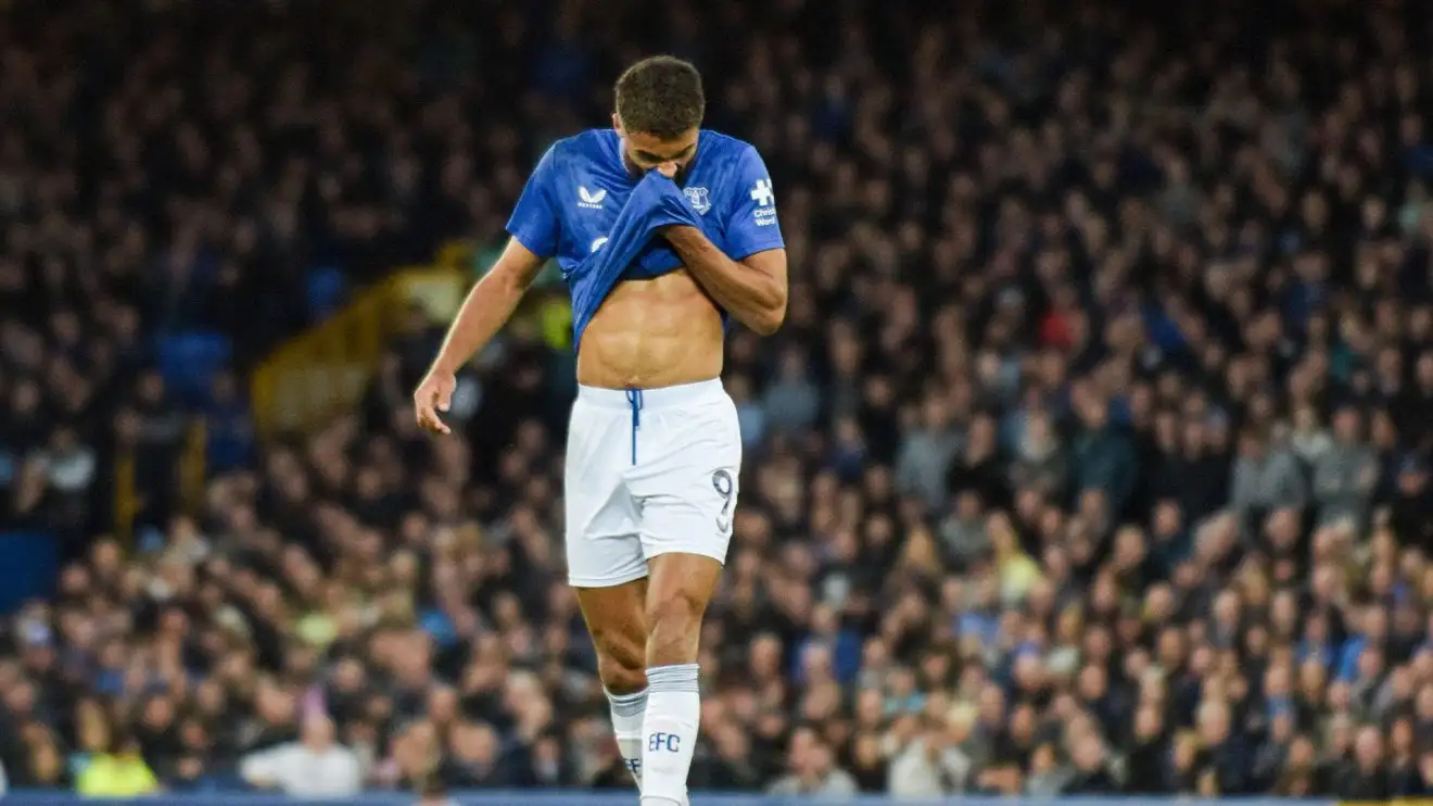 Dominic Calvert-Lewin looks dejected as his raises his shirt to his face