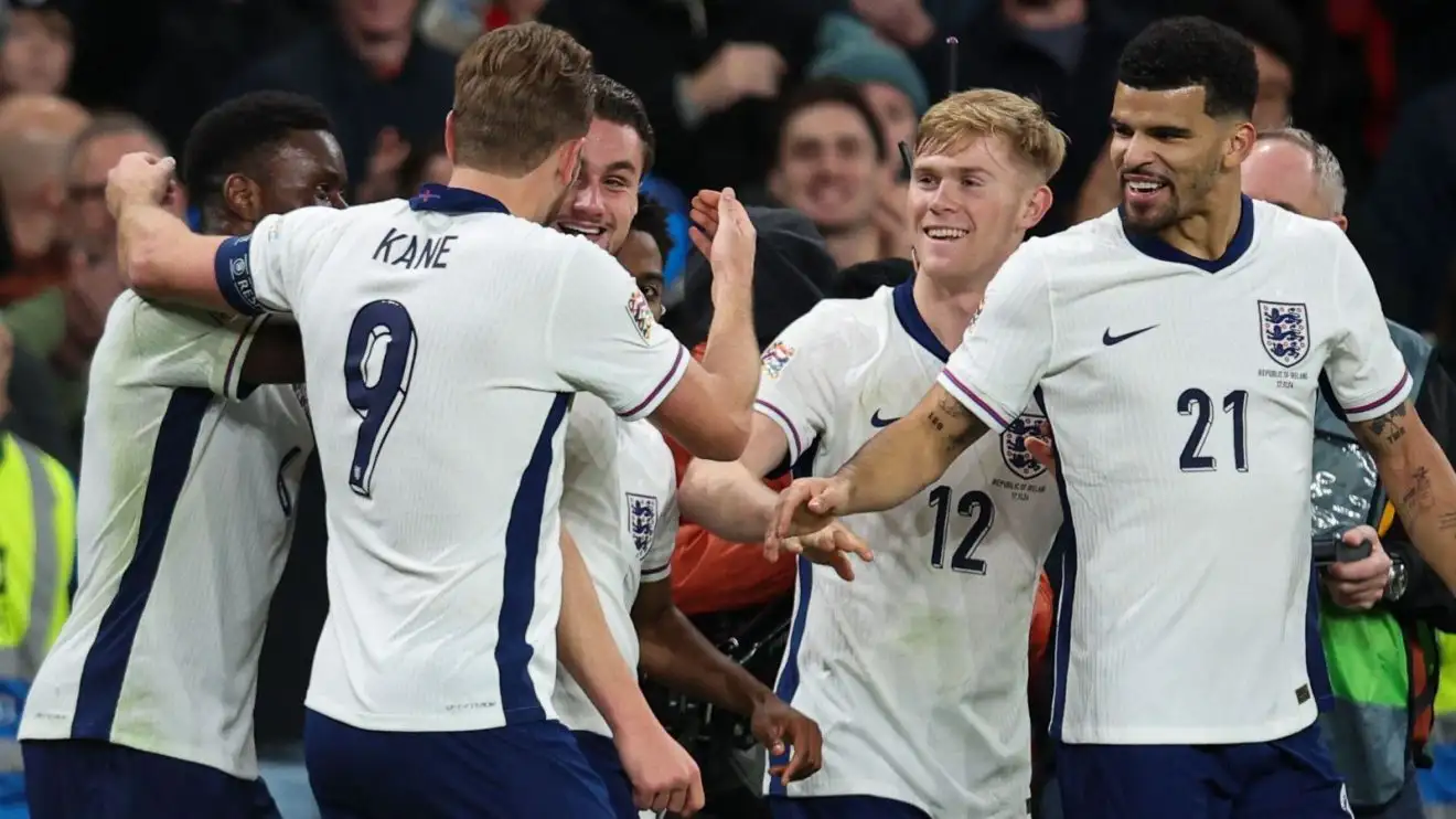 Taylor Harwood-Bellis celebrates with Harry Kane after scoring against Ireland on his England debut