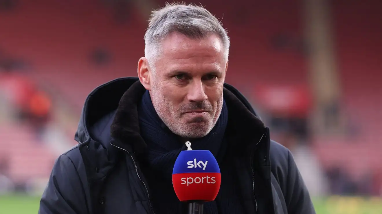 Jamie Carragher withstanding pitchside on punditry obligation