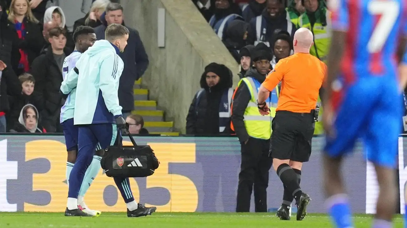 Bukayo Saka is aided off the peddle by a individual of the Medley clinical personnel