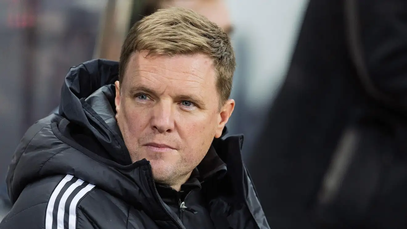 Eddie Howe glances on from a rainy dugout