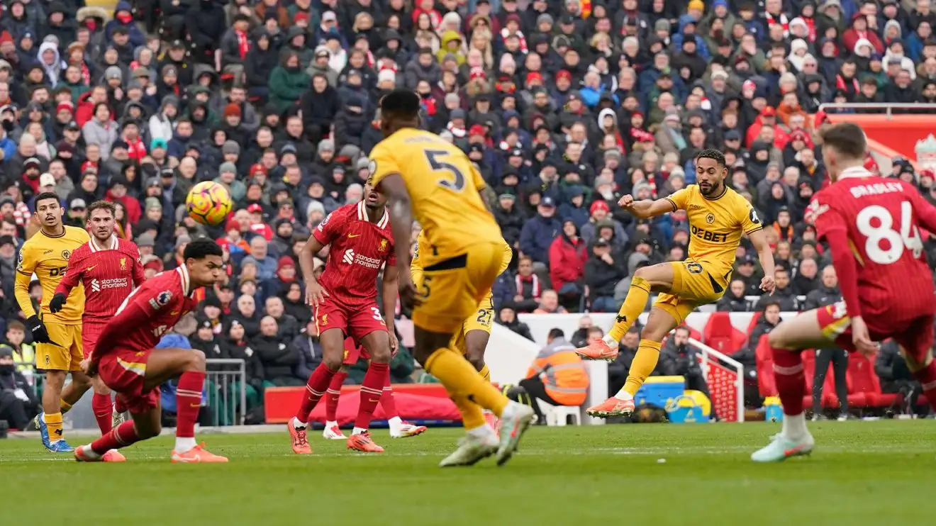 Matheus Cunha fires off his shot through a crowd of players to score for Wolves