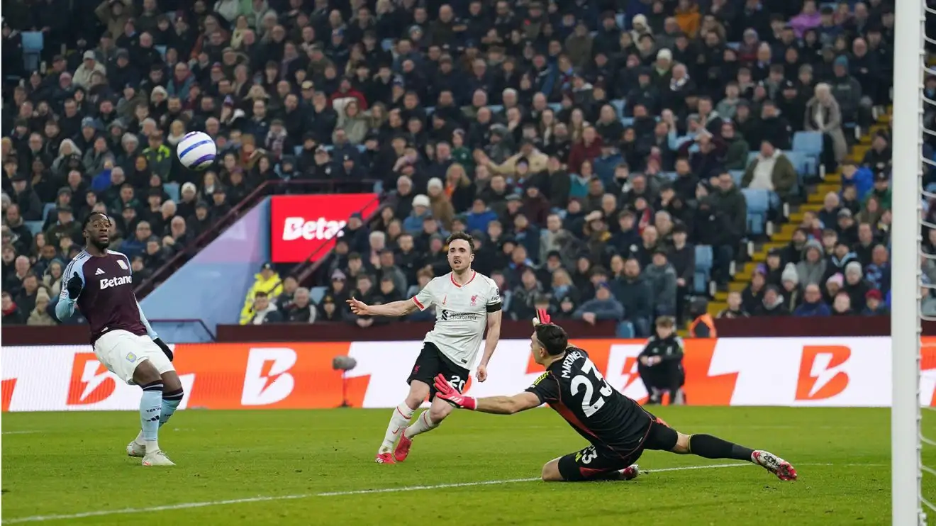 Diogo Jota puts a shot well off target after getting clean through on Emiliano Martinez
