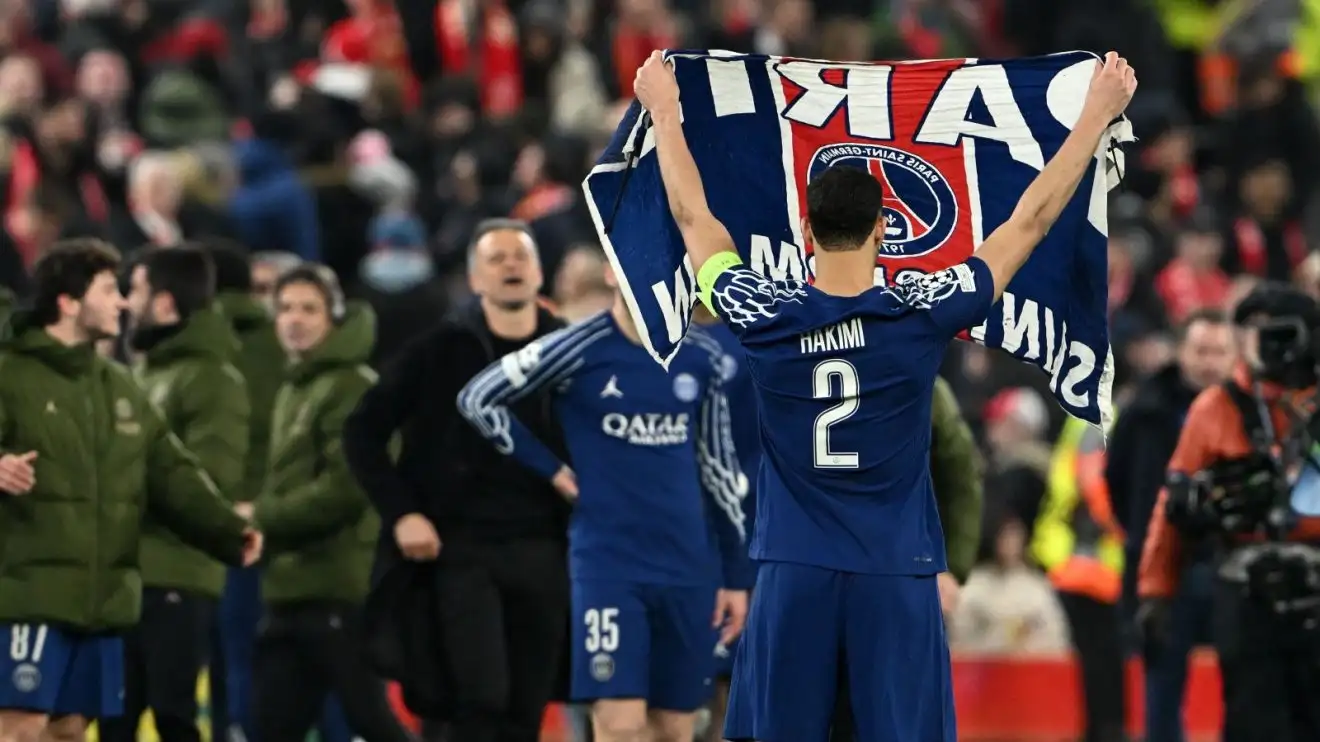 Liverpool 'furious' after PSG Champions League 'antics' 1 Achraf Hakimi grasps up a Paris Saint-Germain flag after the Victors League win over Liverpool at Anfield