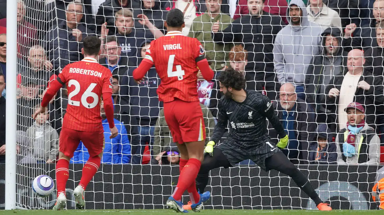 Andy Robertson, Virgil van Dijk and Alisson watch helplessly as Robertson's own goal hits the back of the net