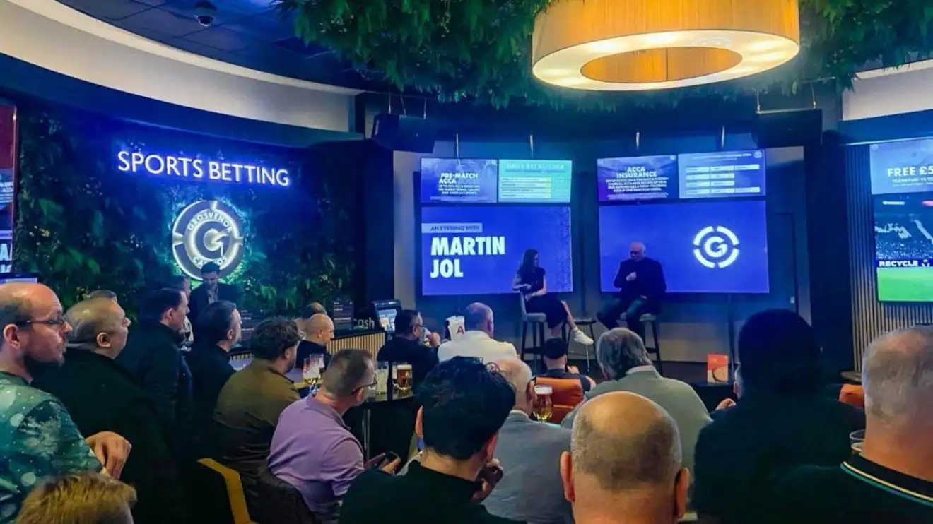 Liverpool urged to complete 'incredible' Harry Kane signing 1 Martin Jol conversing at Grosvenor Casino site Luton’s Sports Betting Lounge with Kate Mason