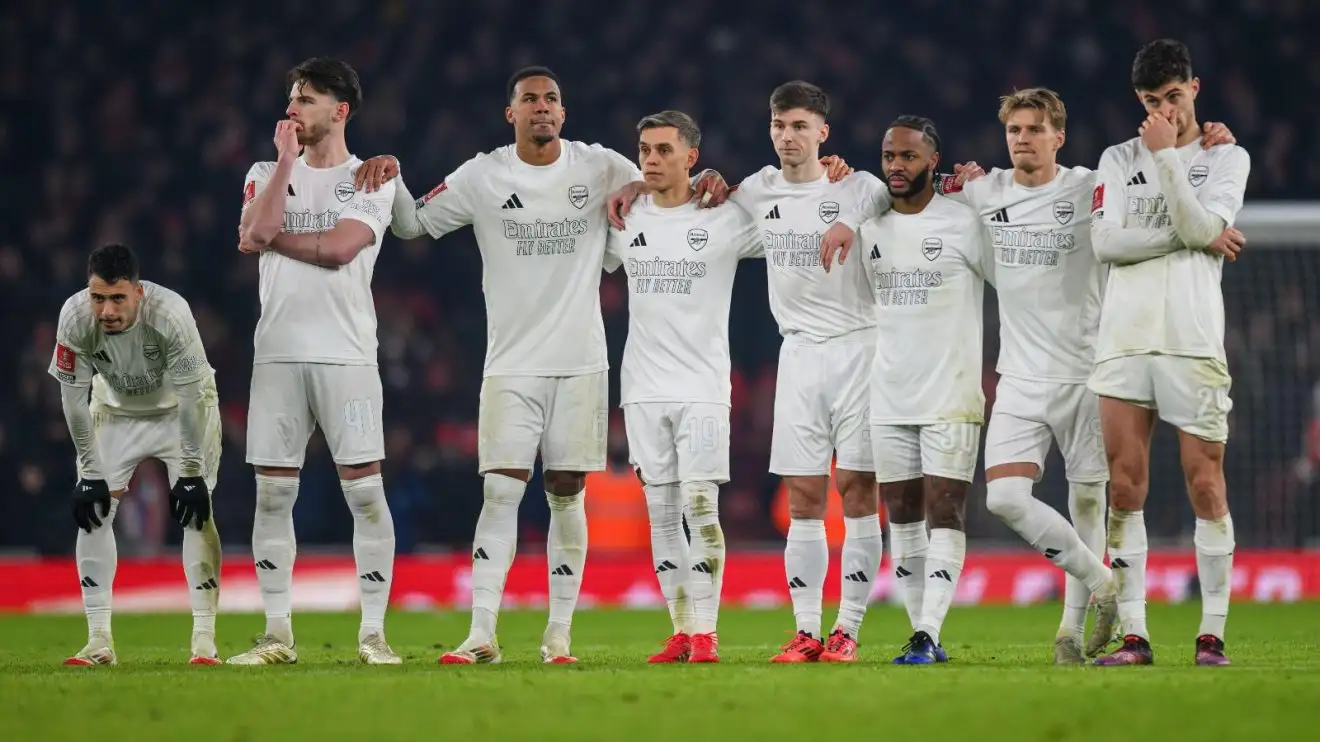 Arsenal player stand together during a penalty shootout