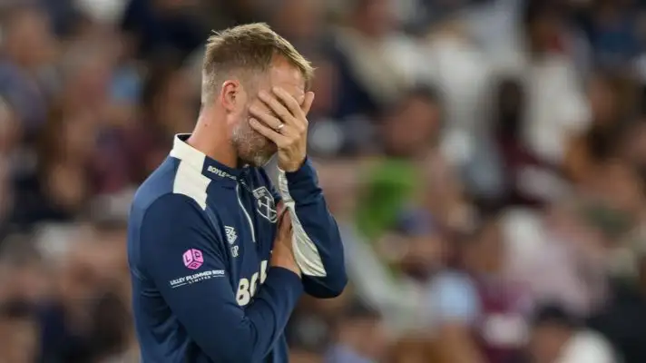 Graham Potter covers his eyes as he watches West Ham struggle in the Premier League