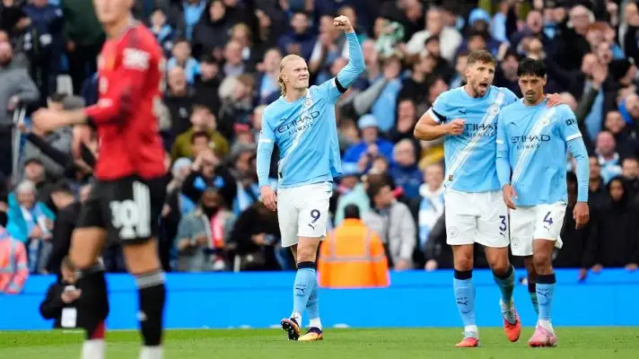 Erling Haaland celebrates scoring in the Manchester derby