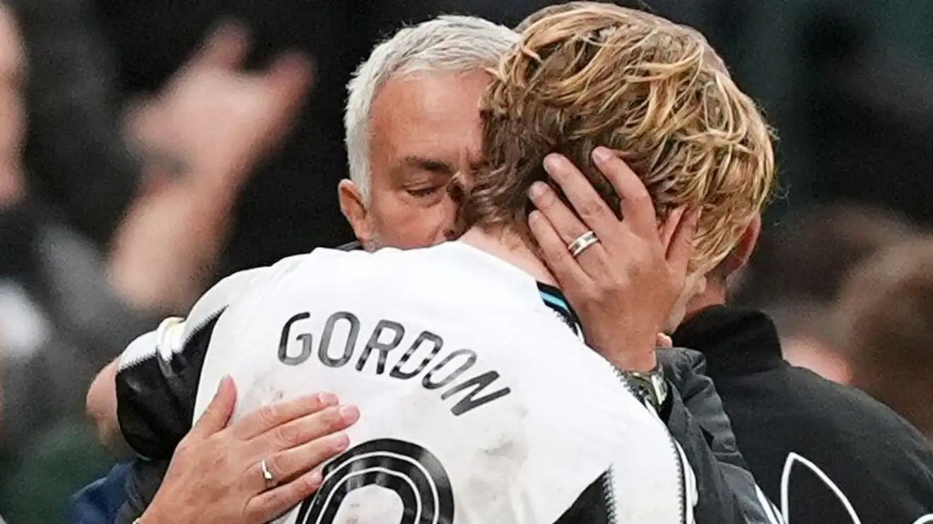 Benfica manager Jose Mourinho embraces Newcastle forward Anthony Gordon