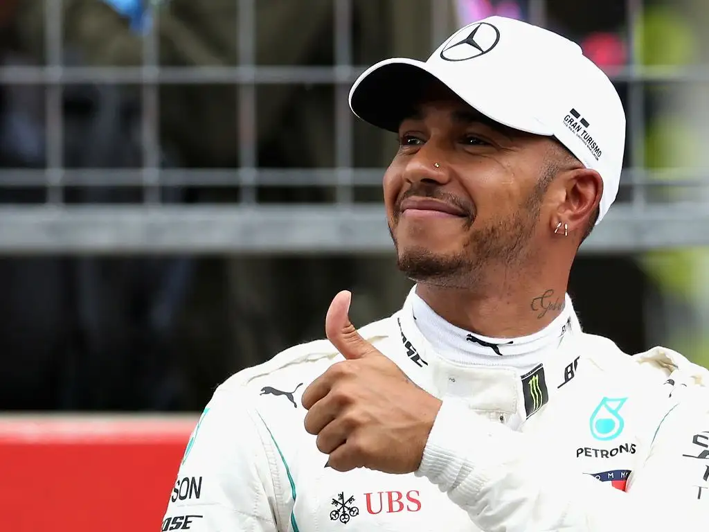 Race: Lewis Hamilton wins as Sebastian Vettel crashes out of lead