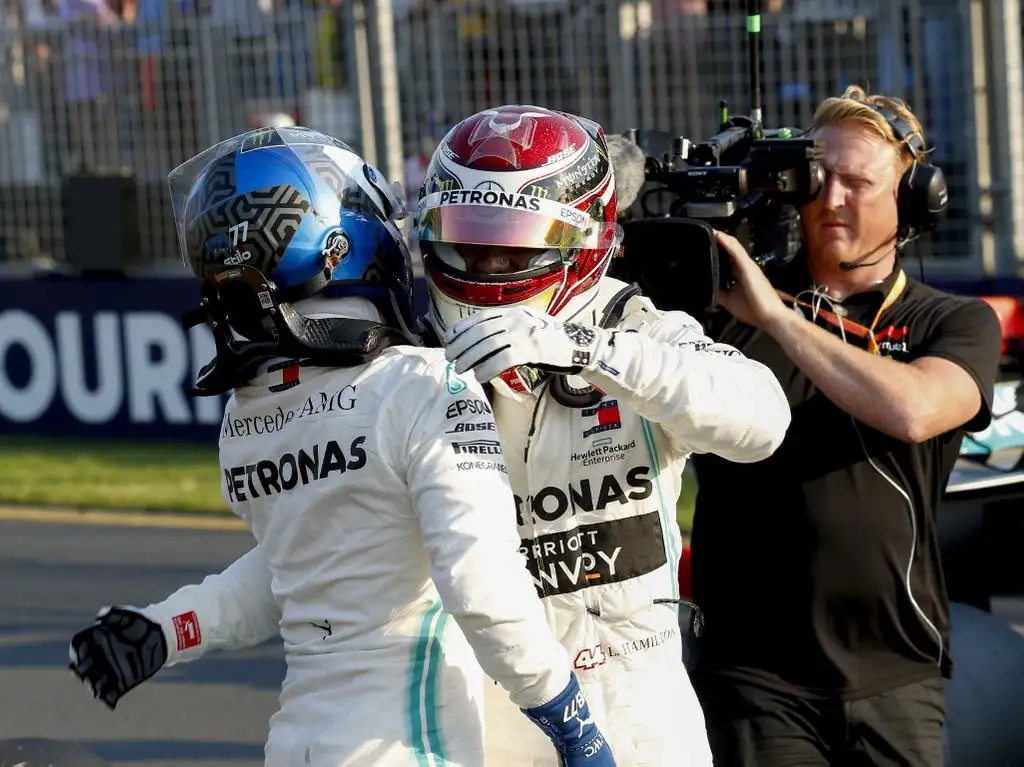 Lewis Hamilton and Valtteri Bottas hug PA