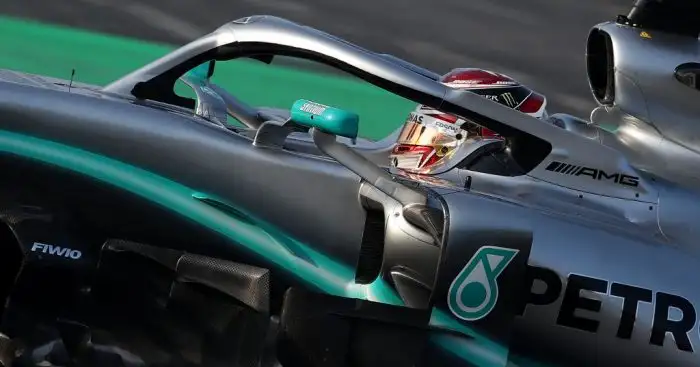 Lewis Hamilton holds off Vettel to claim first P1