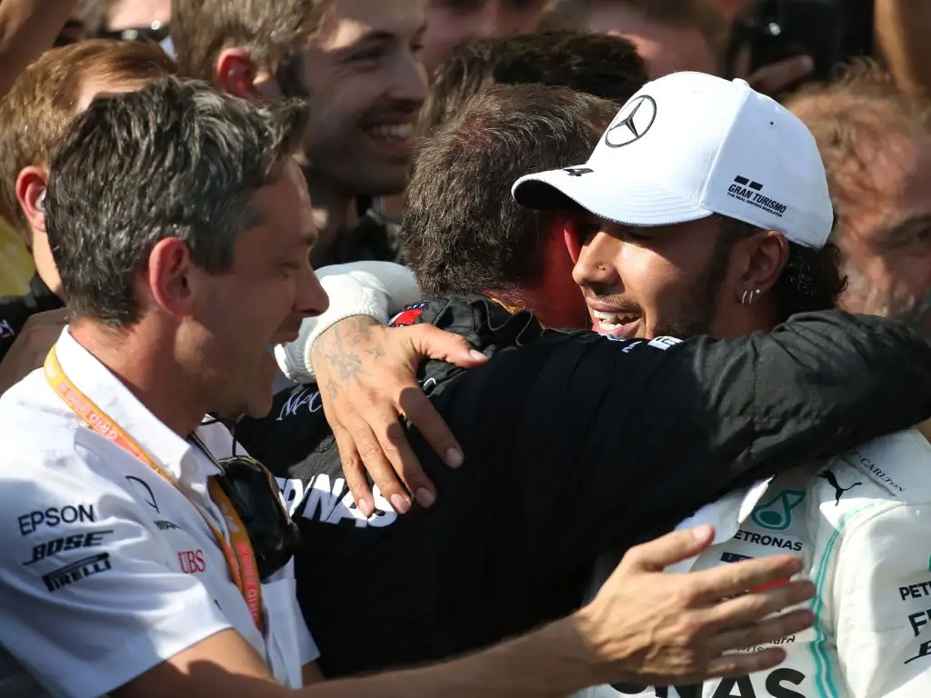 Lewis Hamilton apologises for doubting Mercedes' Hungarian GP-winning strategy.