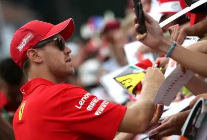 Sebastian-Vettel-signing-autographs-PA