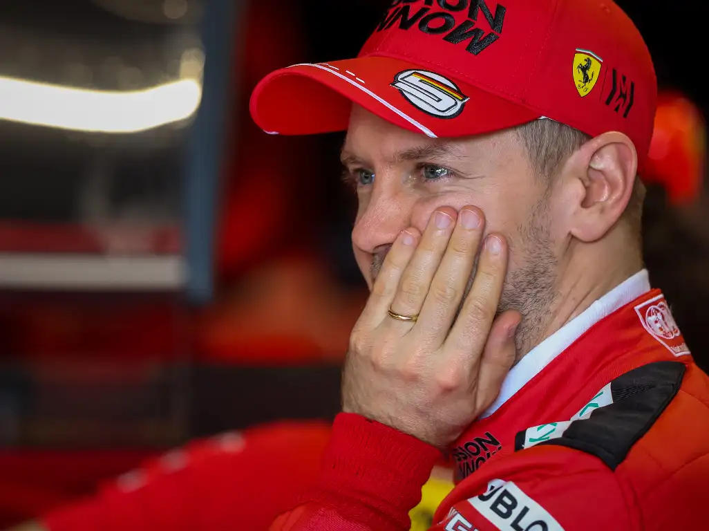 Sebastian-Vettel-hand-to-face