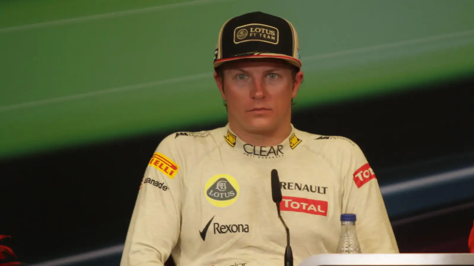 Kimi Raikkonen speaks to media in a press conference as a Lotus driver.